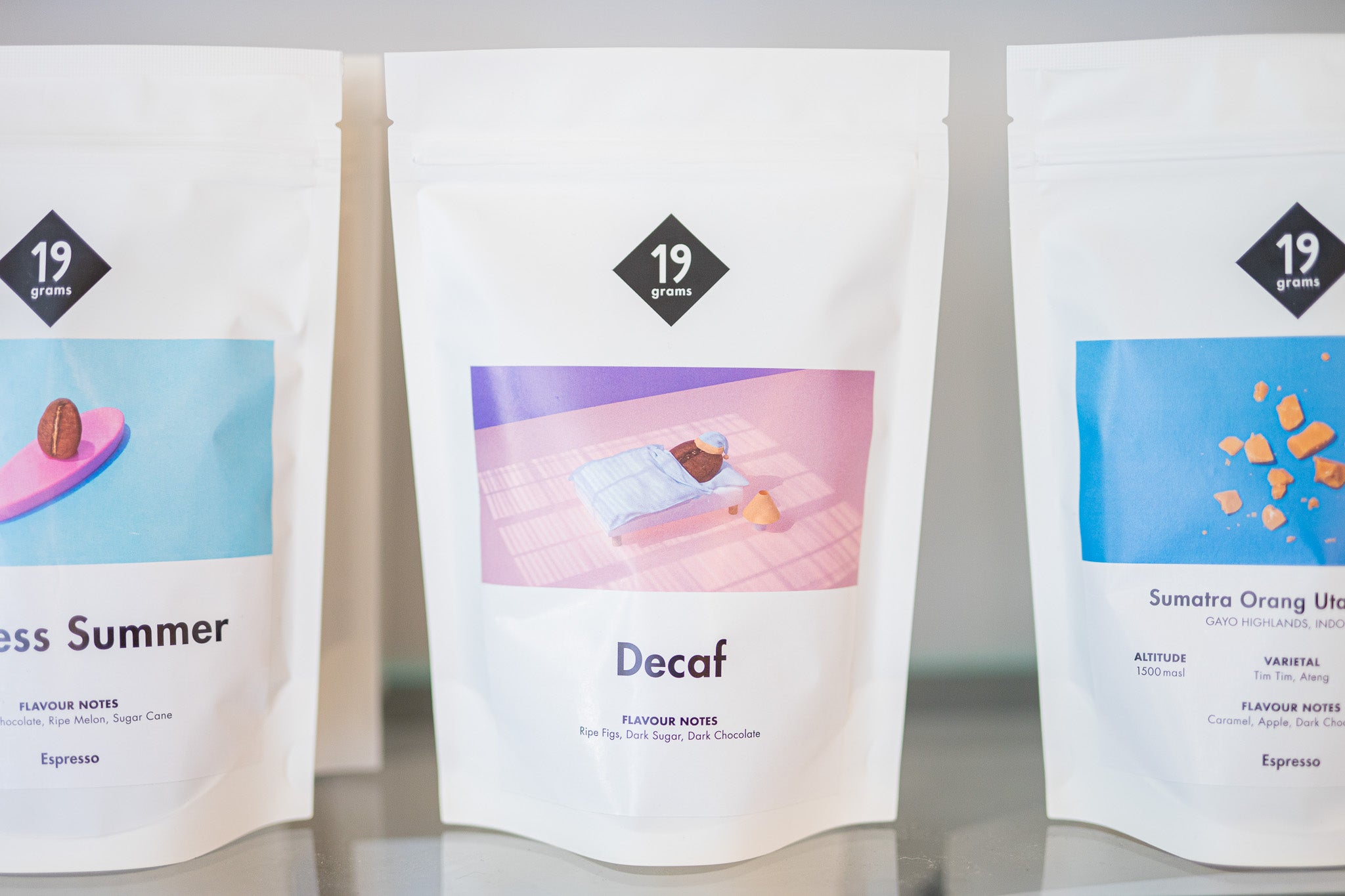 a bag of 19grams decaf coffee beans sits on a shelf